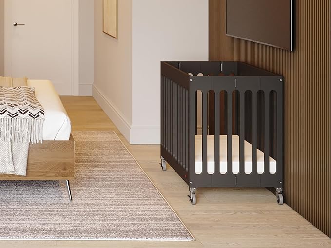 Foundations Boutique Folding Mini Baby Crib - Compact, Portable, Wooden Hotel Crib, Foldable Compact Cribs for Baby & Toddlers - Includes 3" Foam Mattress - Ebony