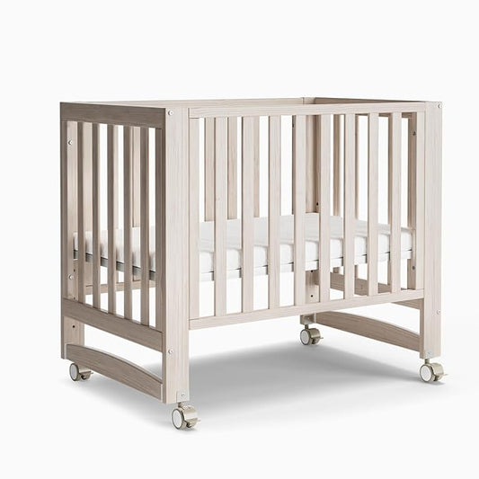 EvoNest Baby Crib, 6 in 1 Convertible Mini Crib with Wheels, 100% New Zealand Solid Wood Growing Bed, 4 Adjustable Mattress Height，Washed Natural