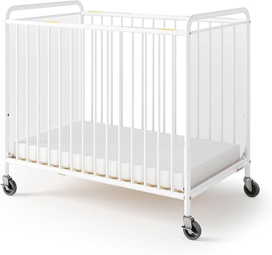 Foundations Chelsea Clearview Metal Compact Daycare Crib, 3" Casters, Compact Mini Size, Easy to Clean Durable Finish, Adjustable to Two Heights Mattress Board (White)
