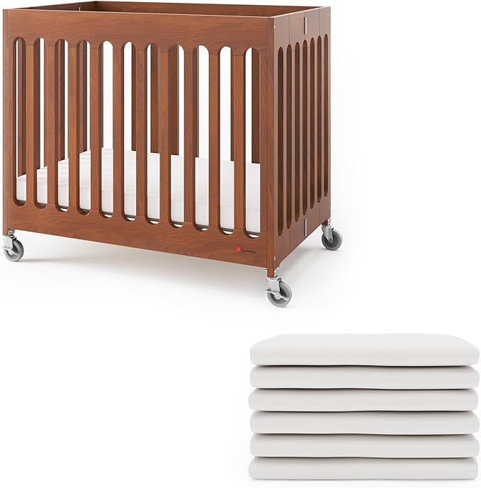 Foundations Boutique Folding Hotel Crib and Sheet Bundle - Includes Wooden Mini Crib with 3" Foam Mattress (Cherry) and 6-Pack White Fitted Compact Sheets